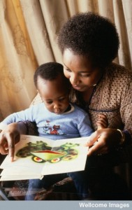 AS0000081F09 Baby, with picture book Credit: Anthea Sieveking . Wellcome Images images@wellcome.ac.uk http://wellcomeimages.org A mother reading a pop-up book to her young son. Photograph Published: - Copyrighted work available under Creative Commons by-nc-nd 4.0, see http://wellcomeimages.org/indexplus/page/Prices.html